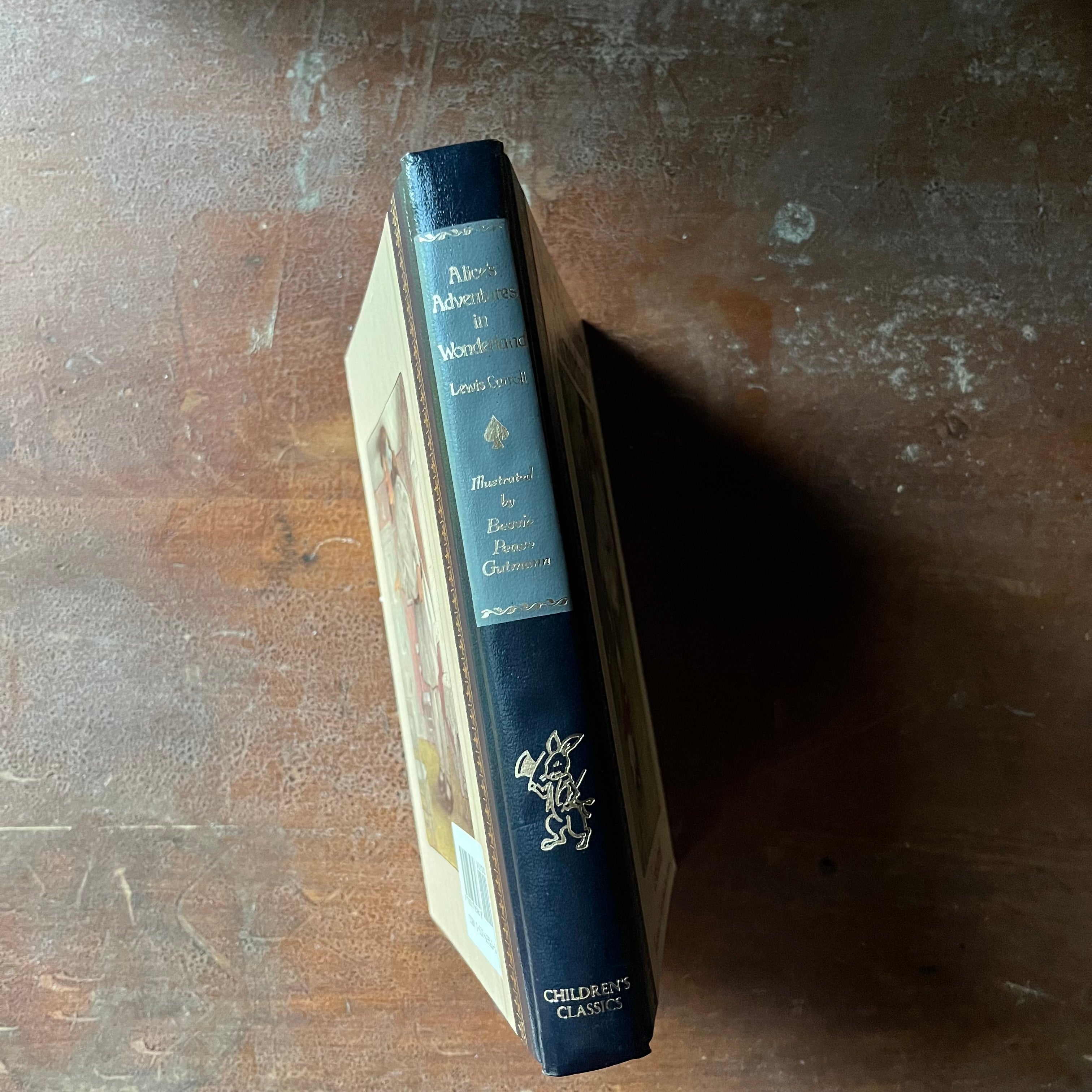 vintage children's classic story - Alice's Adventures in Wonderland written by Lewis Carroll with illustrations by Bessie Peace Gutmann & John Tenniel, Children's Classics Edition - view of the spine