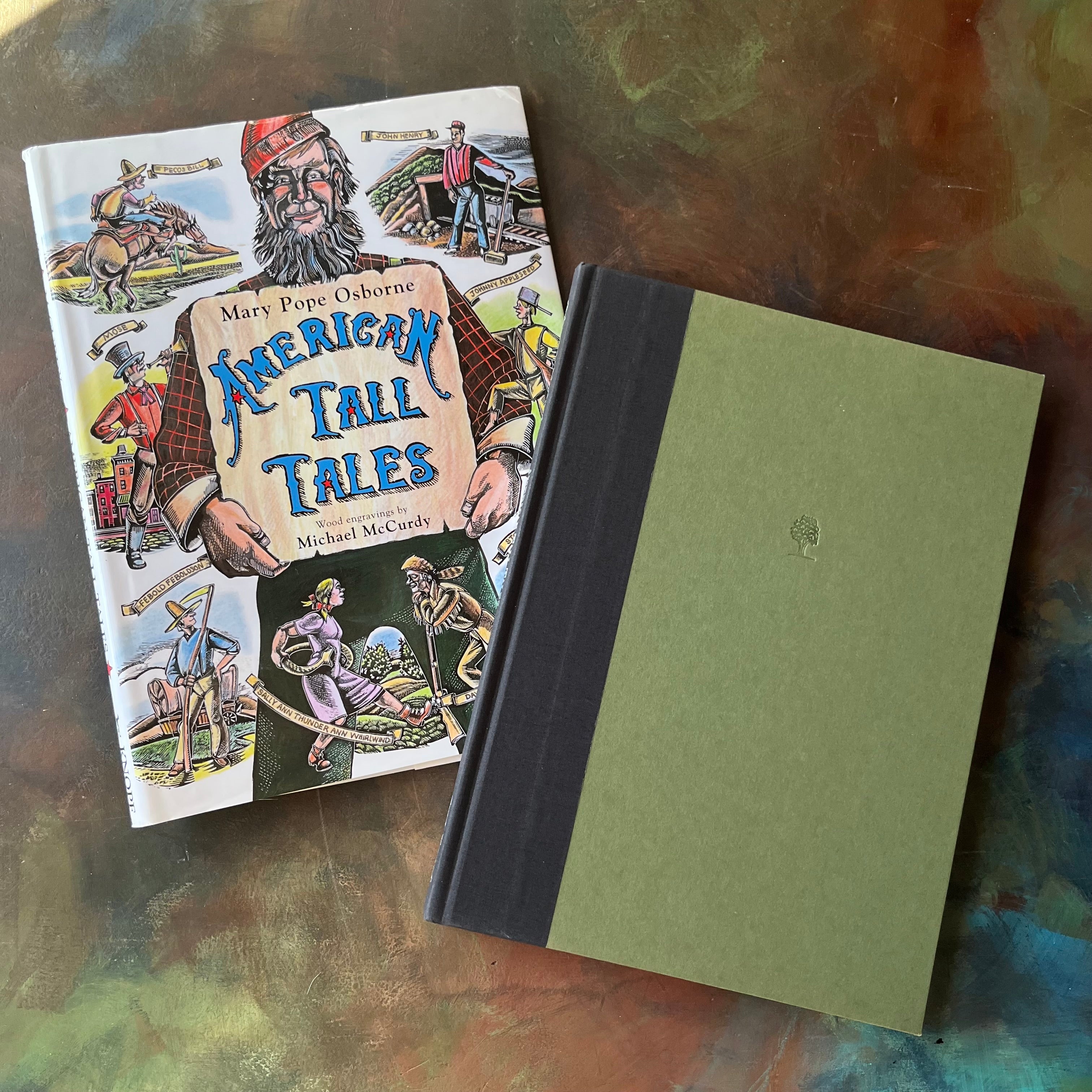 American Tall Tales written by Mary Osborne Pope with wood engravings by Michael McCurdy-American Folktales-folktales for children-colorful illustrations-homeschool library must-have-view of the embossed front cover