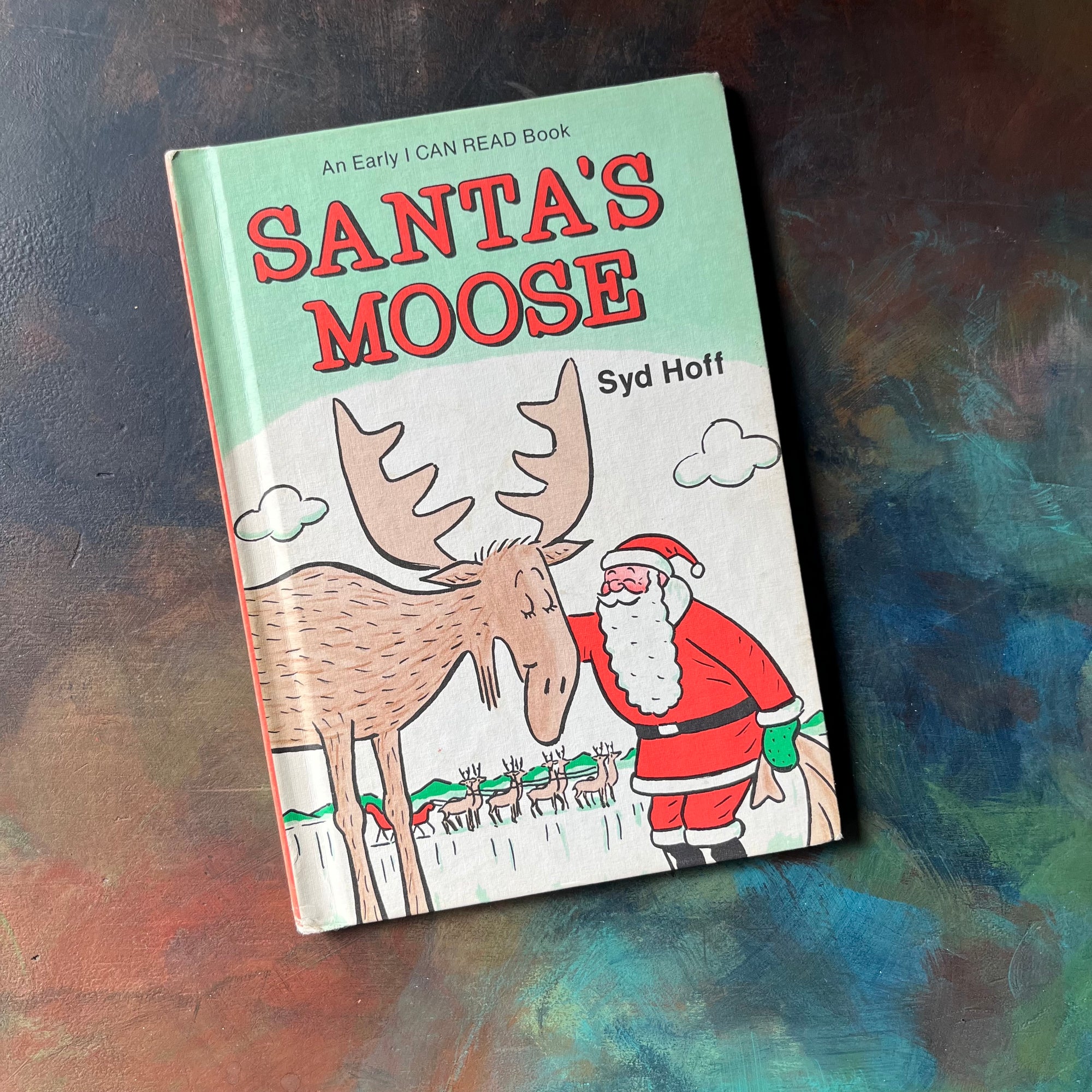 An Early I Can Read Book-Santa's Moose written & illustrated by Syd Hoff-vintage children's picture book-vintage children's Christmas book-view of the front cover with santa petting a large moose