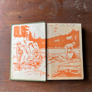 children's chapter book, children's boy scout adventure book - Boy Scouts in a Submarine or Searching an Ocean Floor written by G. Harvey Ralphson - view of the inside cover with orange & white boy scouts with a campfire next to a creek