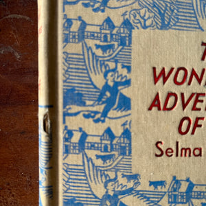 vintage children's chapter books - Dent Dutton Children's Illustrated Classics - The Wonderful Adventures of Nils written by Selma Lagerlof and Granny's Wonderful Chair written by Frances Browne - view of the conditi8on of the spine of The Wonderful Adventures of Nils