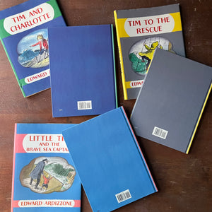 Edward Ardizzone Book Set-Little Tim and the Brave Sea Captain, Tim to the Rescue & Tim and Charlotte-vintage children's picture books-view of the back covers in blue with white isbn blocks at the bottom