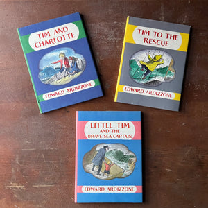 Edward Ardizzone Book Set-Little Tim and the Brave Sea Captain, Tim to the Rescue & Tim and Charlotte-vintage children's picture books-view of the dust jacket's front covers each sporting bright colors & an illustration from the book