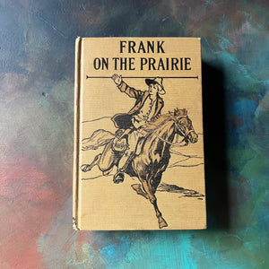 Frank on the Prairie by Harry Castlemon-1893 The John C. Winston Co.-antique adventure book for boys-vintage children's chapter book-view of the embossed front cover with Frank riding a horse