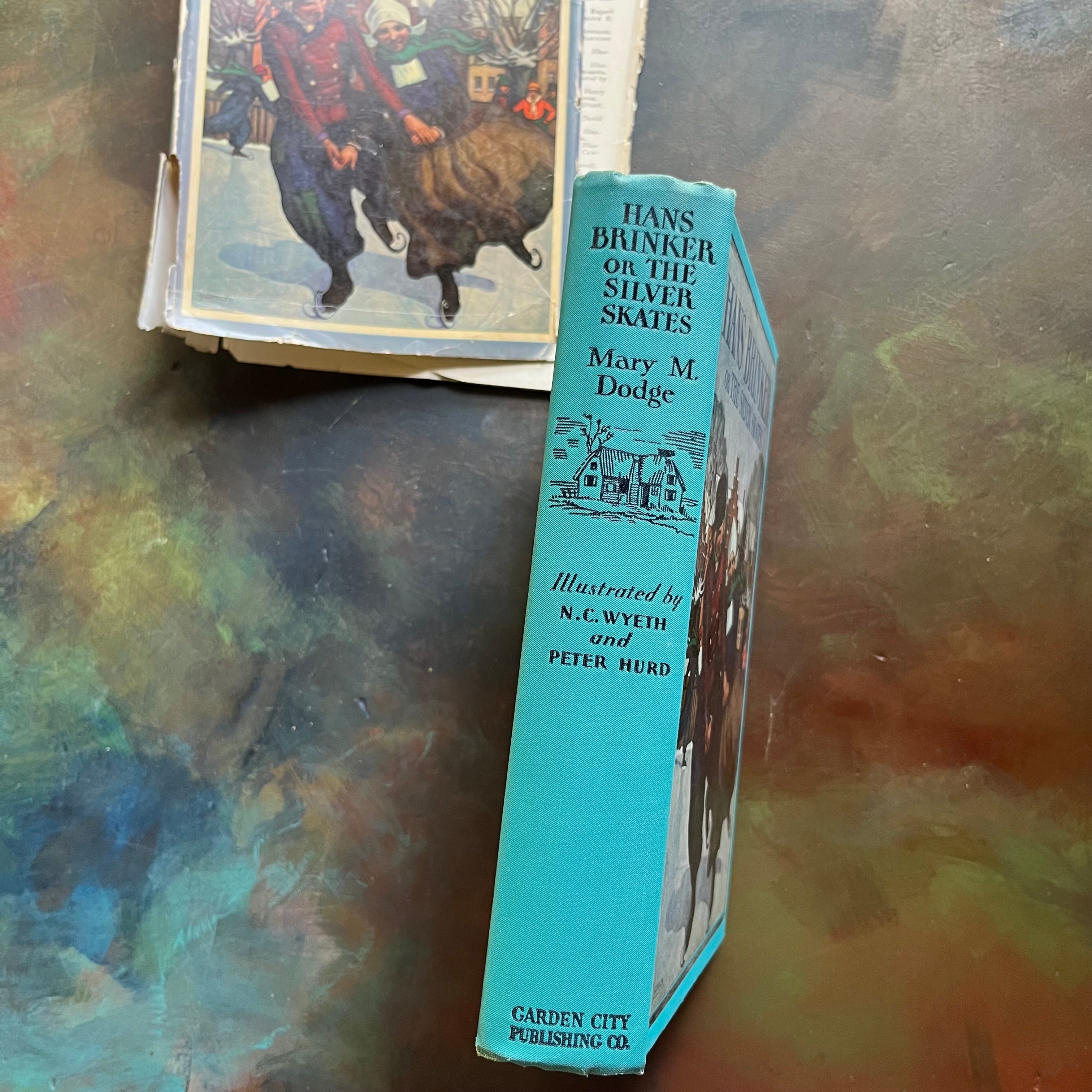 Hans Brinker or the Silver Skates by Mary Mapes Dodge with illustrations by N. C. Wyeth & Peter Hurd-antique children's chapter book-view of the spine