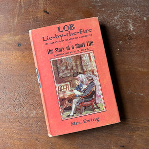 Lob Lie by the Fire The Story of a Short Life by Mrs. Ewing-vintage Dent Dutton Children's Classic Edition-vintage children's chapter book-view of the dust jacket's front cover in pink with an illustration in the center
