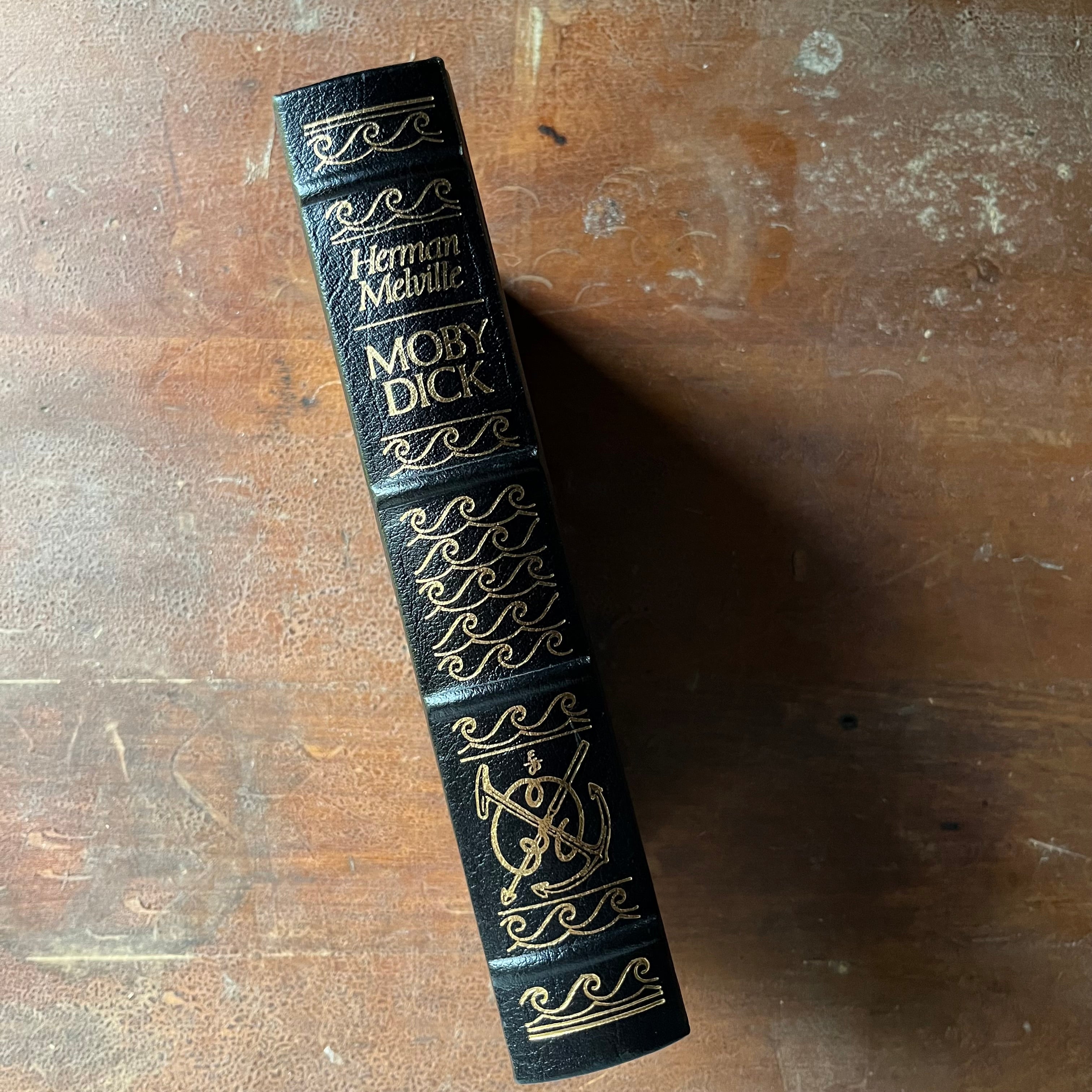 vintage children's chapter book, classic literature, gift book by Easton Press - Moby Dick or The Whale written by Herman Melville with illustrations by Broadhead Robinson - view of the embossed spine