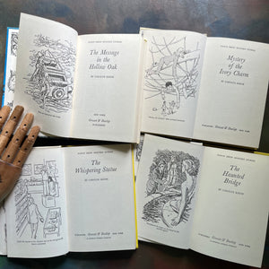 Set of Four Nancy Drew Mysteries written by Carolyn Keene-Books Twelve - Fifteen:  The Mystery in the Hollow Oak, The Mystery of the Ivory Charm, The Whispering Statue, and the Haunted Bridge-view of the title pages