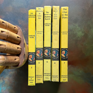 Nancy Drew Mystery Stories Starter Set-Books Three through Seven-vintage children's chapter books-Carolyn Keene-view of the spines