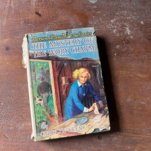 vintage children's chapter book, adventure book for girls, Nancy Drew Mystery Stories- #13 The Mystery of the Ivory Charm written by Carolyn Keene - view of the dust jacket's front cover