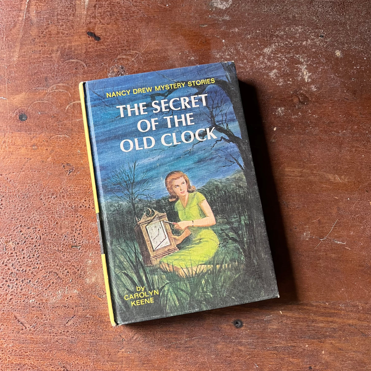 vintage children's chapter books, adventure books for girls - Nancy Drew Mystery Stories #1 The Secret of the Old Clock written by Carolyn Keene with illustrations by Rudy Nappi - view of the front cover