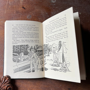 vintage children's chapter books, adventure books for girls - Nancy Drew Mystery Stories #1 The Secret of the Old Clock written by Carolyn Keene with illustrations by Rudy Nappi - view of the illustrations