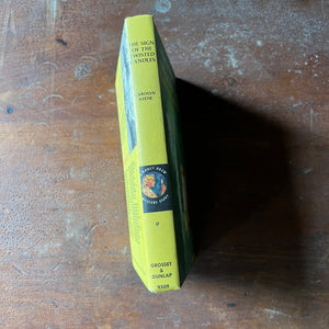 vintage children's chapter book, vintage adventure book for girls, Nancy Drew Mystery Stories - #9 The Sign of the Twisted Candles written by Carolyn Keene - view of the spine