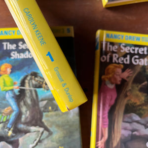 vintage children's chapter books, vintage book set - Nancy Drew Starter Set in Box Sleeve by Carolyn Keene-Volumes 1-6 - view of the condition of volume one's spine
