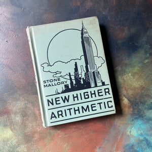 New Higher Arithmetic by Stone & Mallory-vintage mathematics textbook-view of the embossed front cover with skyscrapers shown along with publisher & title