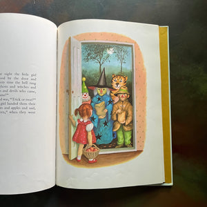 Over and Over written by Charlotte Zolotow with illustrations by Garth Williams-vintage children's picture book-view of the illustrations by Garth Williams - children in Halloween costumes at the door