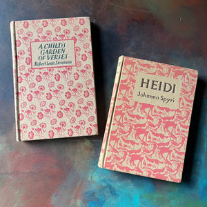 vintage children's books with decorative covers - Pair of Dent Dutton Books:  Heidi written by Johanna Spyri & A Child's Garden of Verses written by Robert Louis Stevenson - view of the embossed covers in shades of pink & cream