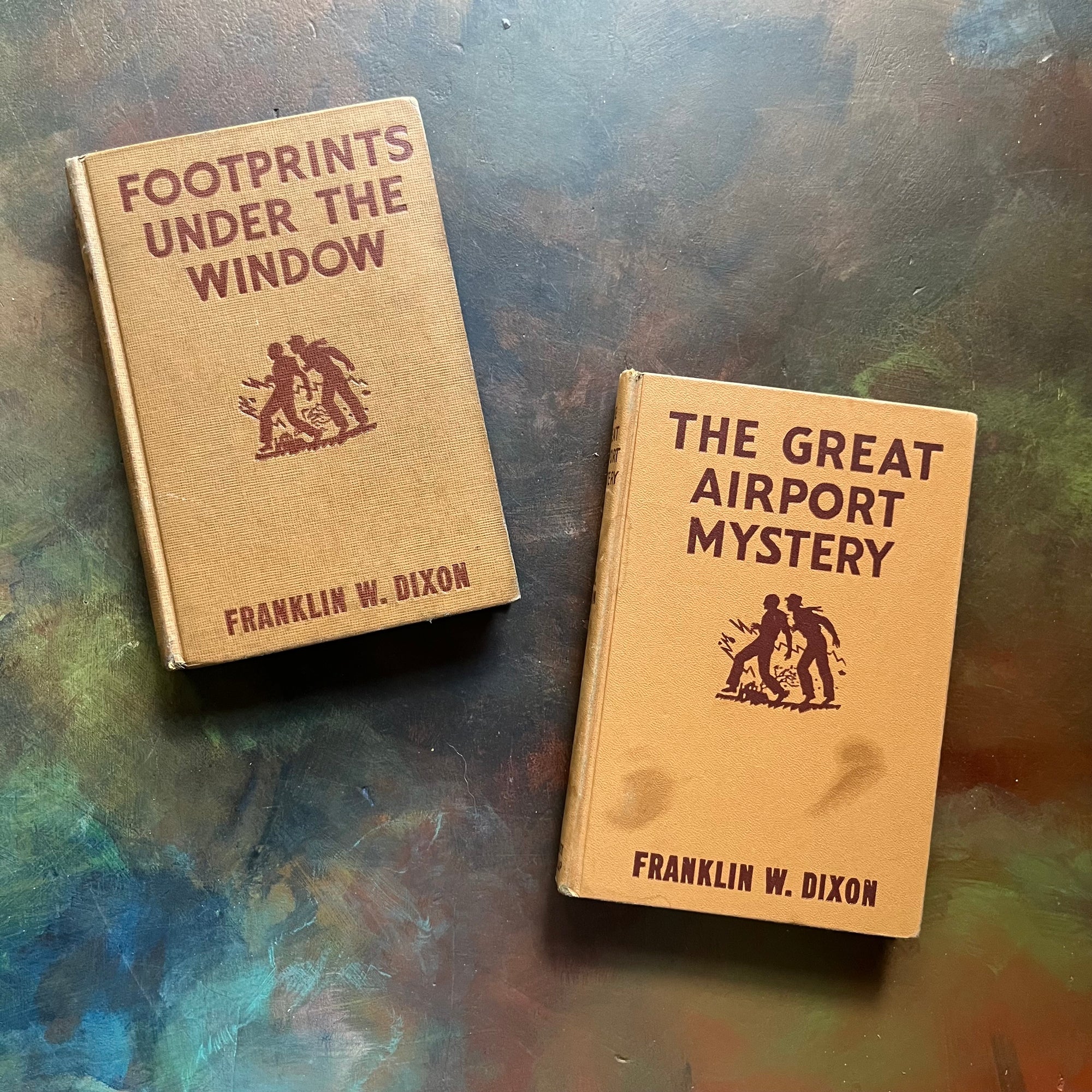 Pair of Hardy Boys Mysteries by Franklin W. Dixon-The Great Airport Mystery #9-Footprints Under the Window #12-chapter books-view of the front covers