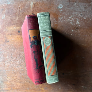 Pair of vintage children's chapter books written by Horatio Alger, Jr.:  Try & Trust & Falling in with Fortune - view of the embossed spines