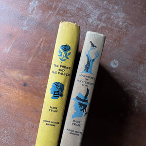 vintage children's books, classic American Literature - Pair of Junior Deluxe Editions Books Written by Mark Twain - The Adventures of Huckleberry Finn & The Prince and the Pauper - view of the spines