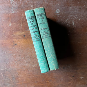 Pair of Lucy Maud Montgomery Books-Anne of Green Gables and Anne of Avonlea-antique American Classic Literature-view of the mint green spines with title, author's last name & publisher listed at the top