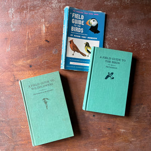 vintage nature guides - Pair of Peterson Field Guides-Field Guide to the Birds & Field Guide to Wildflowers - view of the front covers with title & a small illustration of the topic of the book in this case a wildflower & a bird