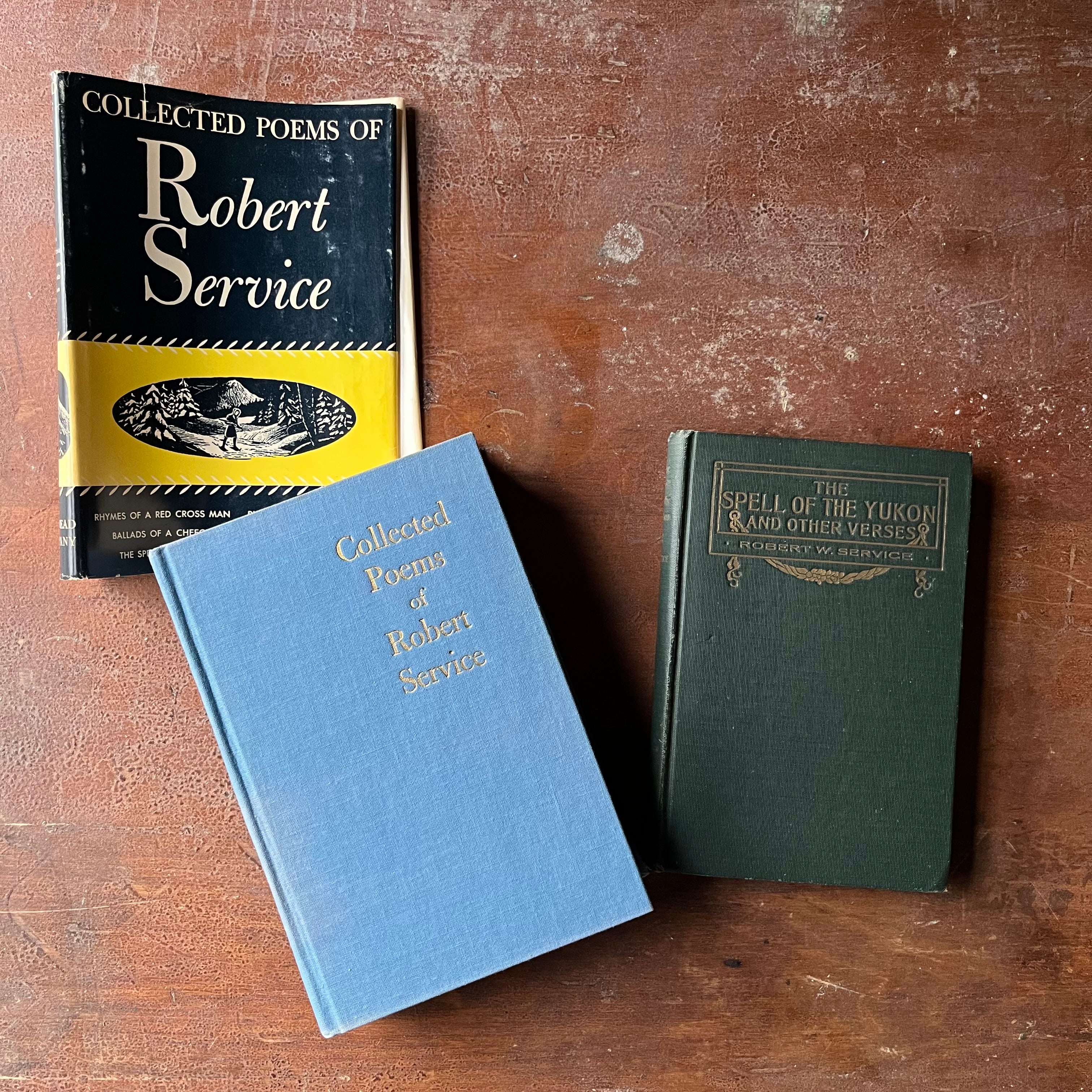 Pair of Robert Service Books-The Spell of the Yukon and Other Verses and Collected Poems of Robert Service-vintage poetry books from the Canadian Yukon-view of the front covers - clothbound