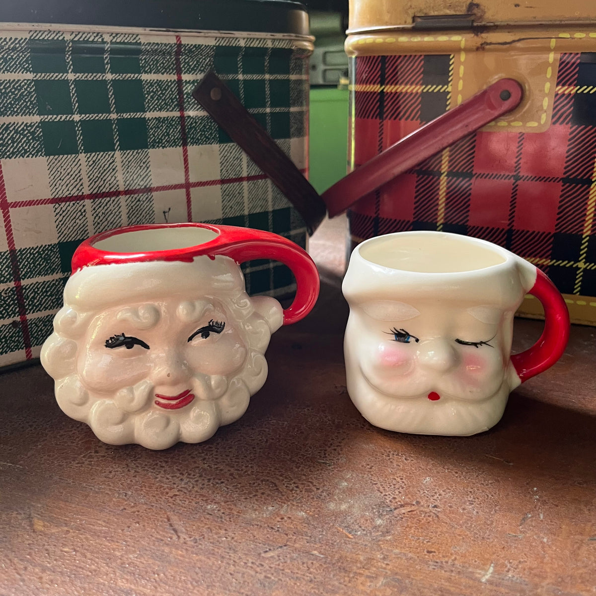 Pair of vintage Santa mugs-winking Santa mug - view of the front of the mugs - one winking santa one with both eye open