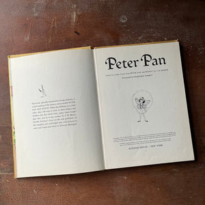 vintage children's chapter book, J. M. Barrie's Peter Pan & Wendy - Peter Pan a 1957 Edition Edited by Josette Frank with illustrations by Marjorie Torrey - view of the title page with copyright listed as 1957