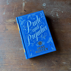 Pride and Prejudice written by Jane Austen-2011 Barnes & Noble Edition-classic literature in a modern edition-view of the front cover in blue, white and gold design