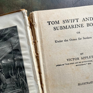 Set of 5 Tom Swift Antique Books written by Victor Appleton-adventure books for boys-view of the cracked/loose binding in Tom Swift & His Submarine Boat