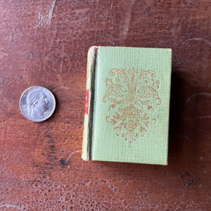 Set of Five Miniature Portuguese Dictionaries-antique tiny books-closeup of the front cover with beautiful design in gold