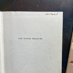 Set of Four Hardy Boys Books written by Franklin W. Dixon-Brown Tweed Covers-The Tower Treasure, The Melted Coins, The Secret of Wildcat Swamp & The Crisscross Shadow-view of the name written on the half title page of The Tower Treasure