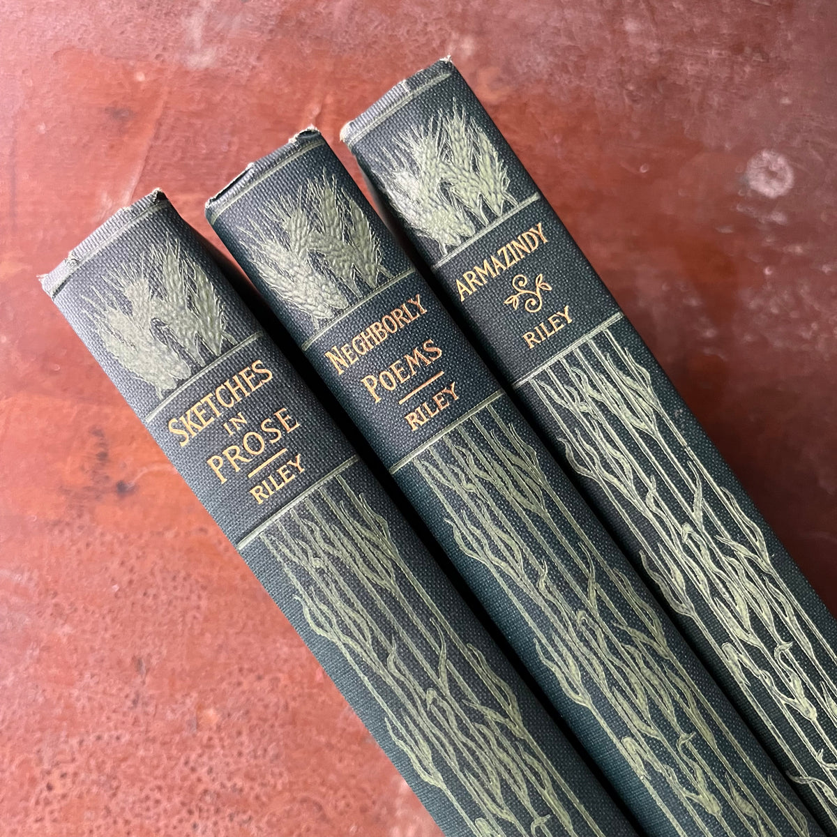 Set of Three James Whitcomb Riley Books:  Sketches in Prose, Neighborly Poems, and Armazindy - view of the embossed spines in two shades of green with gold lettering