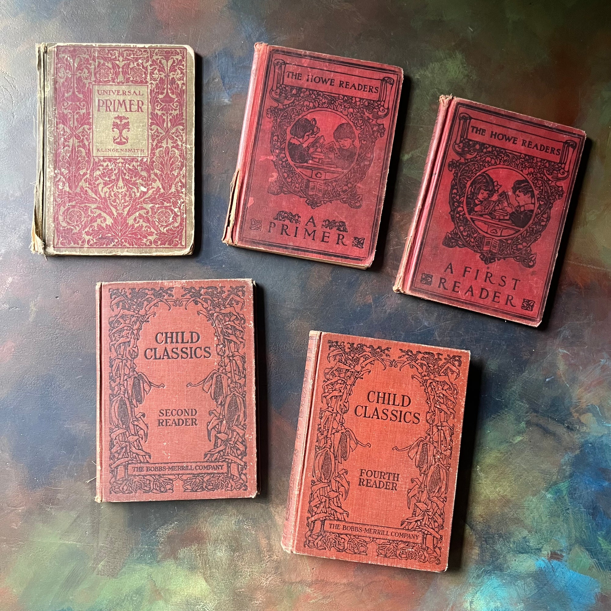 Shabby Vintage School Book Stack-Vintage School Primers Book Set of 5:&nbsp; Child Classics Fourth Reader, Child Classics Second Reader, The Howe Readers A First Reader, The Howe Readers A Primer, and Universal Primer-view of the front covers