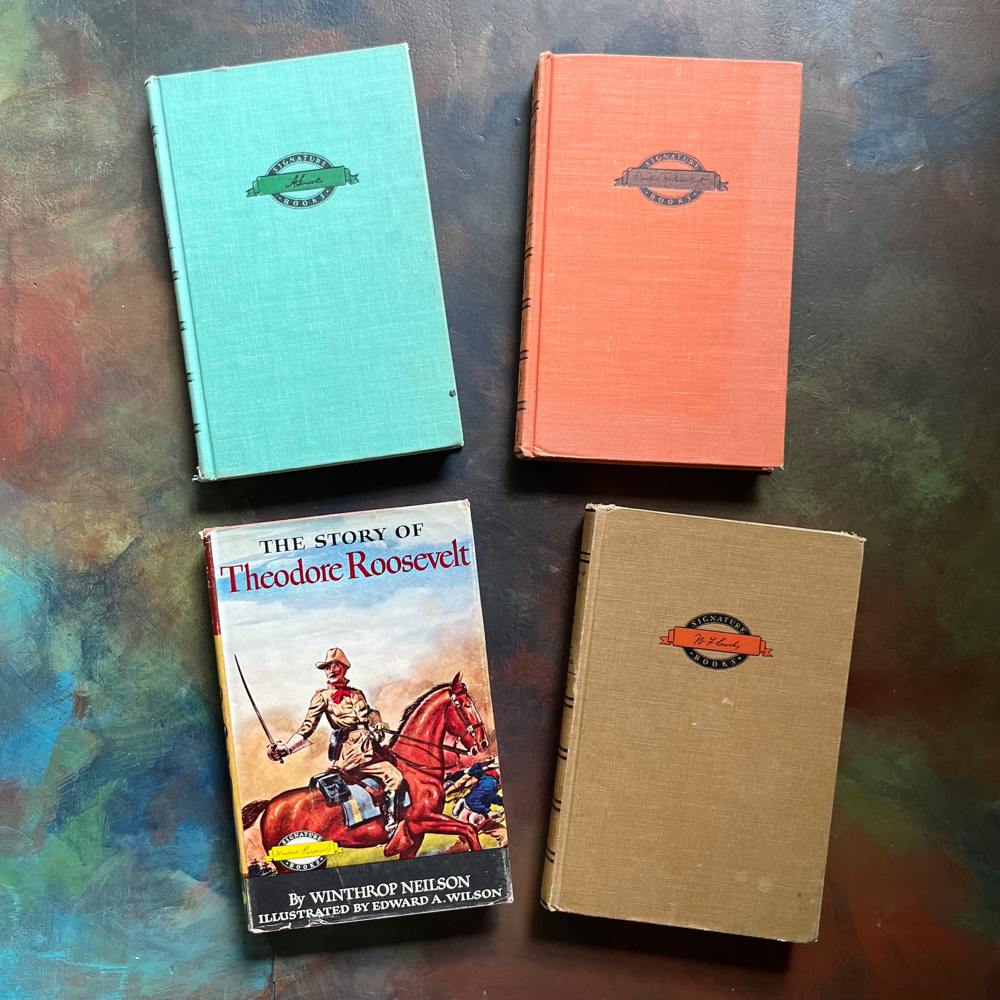 Signature Series History Book Set-vintage children's living history books-Amelia Earhart-Abraham Lincoln-Theodore Roosevelt-Buffalo Bill-view of the front covers - Theodore Roosevelt has its original dust jacket