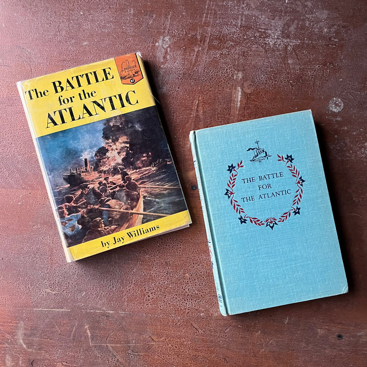 The Battle for the Atlantic by Jay Williams-Landmark Series History Book for Children-view of the embossed front cover with floral horseshoe design with name of the book inside the horseshoe