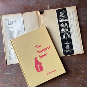 vintage children's picture book, Weekly Reader Children's Book Club Edition, Caldecott Award Winner - The Biggest Bear story and pictures by Lynd Ward - view of the embossed front cover noting the bookmark on the back dust jacket flap