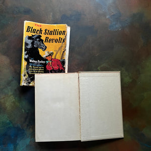 The Black Stallion Revolts by Walter Farley-vintage Black Stallion Serie Book-adventure books for children-view of the back, inside cover - note the crack at the spine