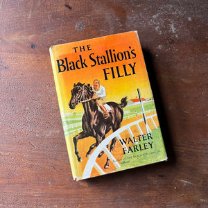 vintage children's chapter book, vintage adventure book for children, The Black Stallion Series - The Black Stallion's Filly written by Walter Farley with illustrations by Milton Menasco - view of the dust jacket's front cover