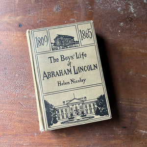 vintage non-fiction - The Boys' Life of Abraham Lincoln written by Helen Nicolay with illustrations by Jay Hambridge - view of the embossed front cover with a log cabin & the white house illustrations