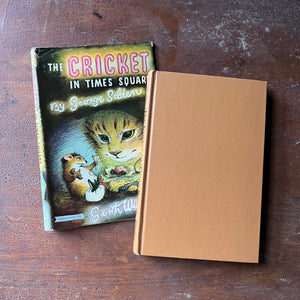 vintage children's chapter book, Newbery Honor Book - The Cricket of Times Square written by George Shelden with illustrations by Garth Williams - view of the front cover which is a plain tan color