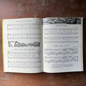 vintage children's schoolbook, vintage schoolbook - The Kindergarten Book Enlarged Edition Our Singing World - view of the black and white illustrations & sheet music