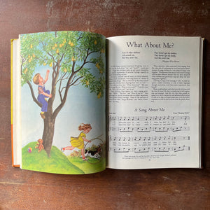 vintage children's schoolbook, vintage schoolbook - The Kindergarten Book Enlarged Edition Our Singing World - view of the full-color illustrations