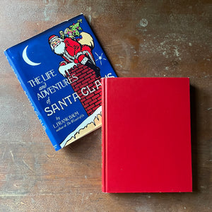 vintage children's chapter book - The Life & Adventures of Santa Claus written by L. Frank Baum with illustrations by Mary Cowles Clark - view of the front cover in red