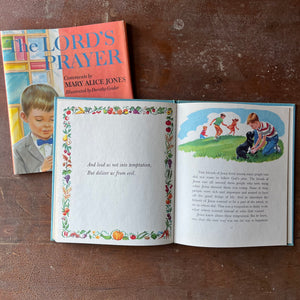 Log Cabin Vintage - vintage children's book, vintage religious book, Learning the Lord's Prayer - The Lord's Prayer Comments by Mary Alice Jones with Illustrations by Dorothy Grider - view of the illustrations - a boy playing with a dog with other children in the background