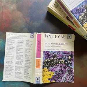 The Macmillan Classics Book Series-Jane Eyre written by Charlotte Bronte and Little Women written by Louisa May Alcott-vintage children's classic literature-view of the dust jacket's covers showing wear at the top edge of the spine & front cover