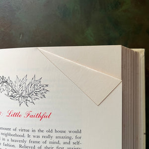 The Macmillan Classics Book Series-Jane Eyre written by Charlotte Bronte and Little Women written by Louisa May Alcott-vintage children's classic literature-view of a page fold in Little Women