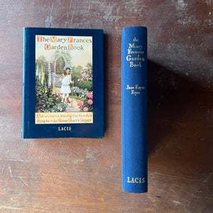 The Mary Frances Garden Book:  Adventures Among The Garden People written by Jane Eayre Fryer-Lacis Edition - view of the embossed spine in blue with gold lettering