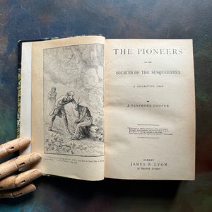 The Pioneers written by James Fenimore Cooper-book one of the leather stocking tales-antique leather-bound book with marbled cover-vintage adventure book-view of the title page & frontispiece